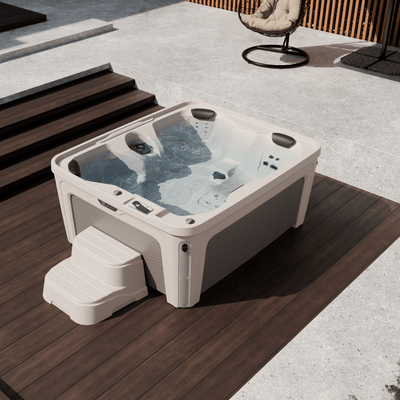 spa caldera invite 4 places installe sur une terrasse moderne avec eau en fonctionnement